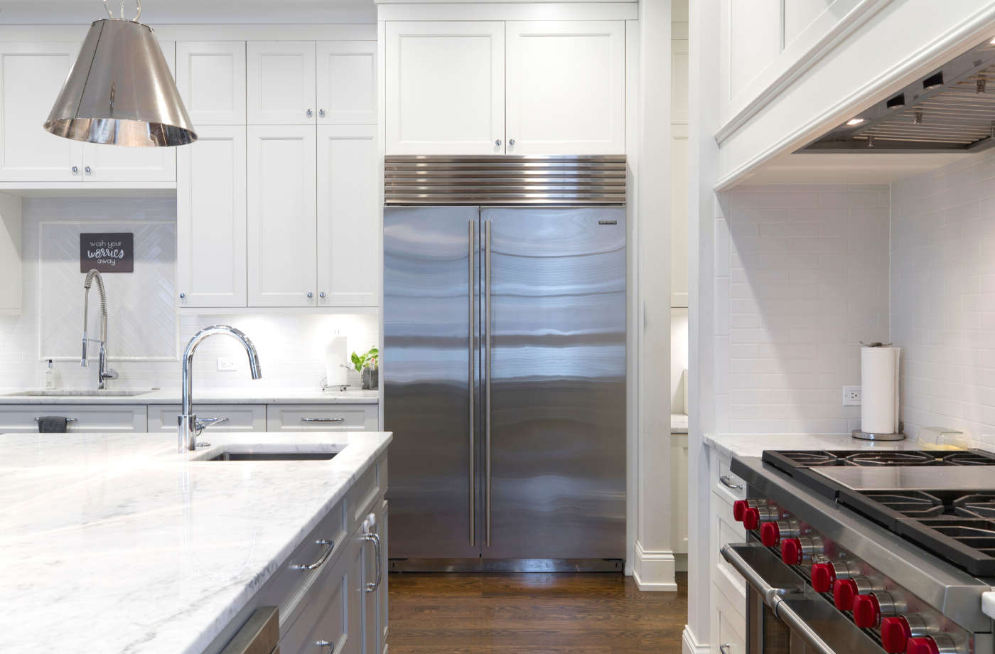 interior of a kitchen with stainless steel appliances