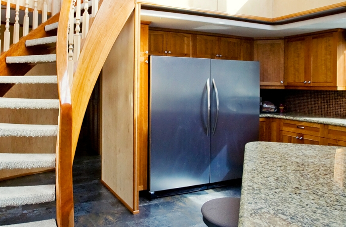 interior of a kitchen with stainless steel appliances