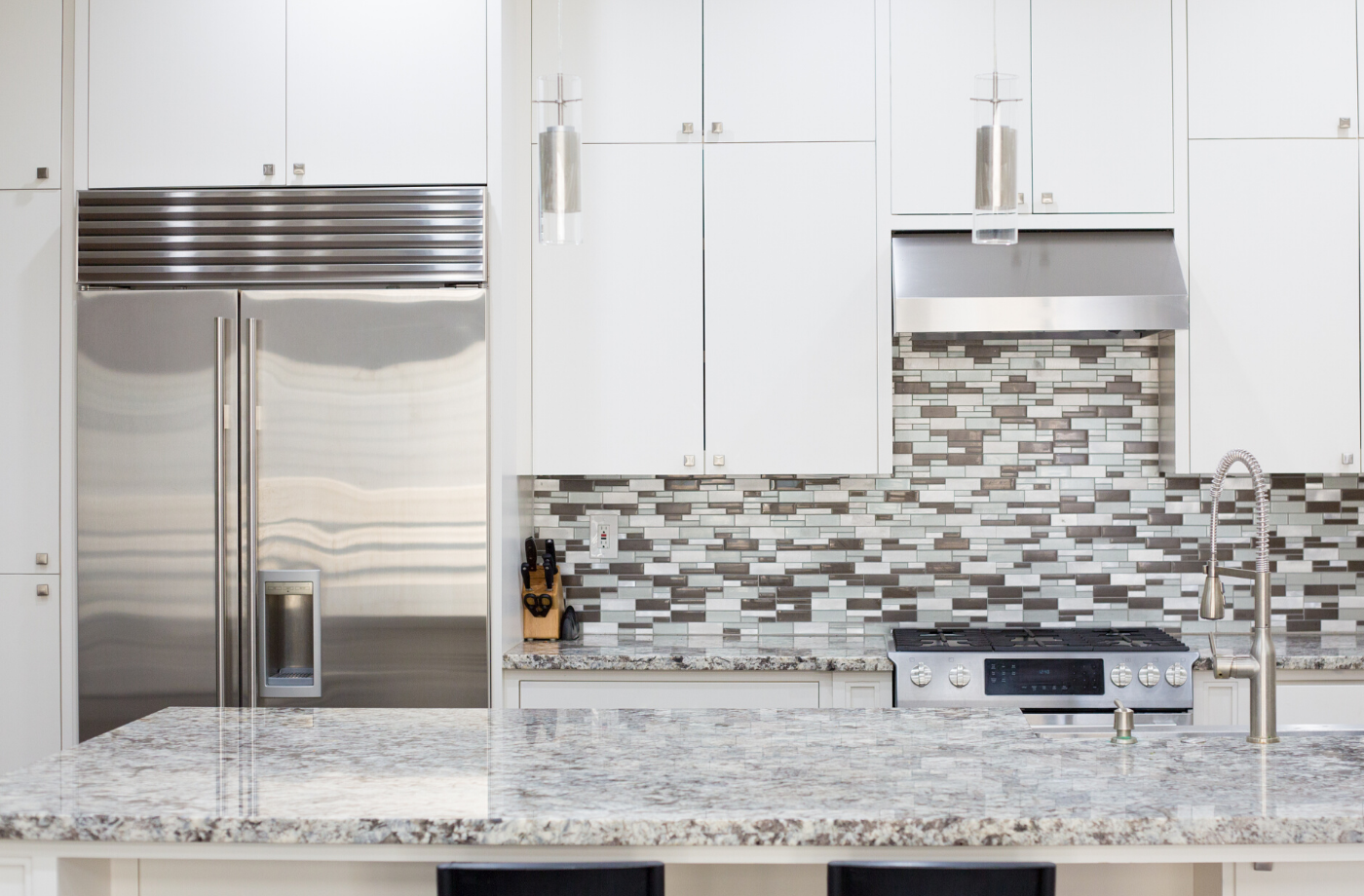 interior of a kitchen with stainless steel appliances